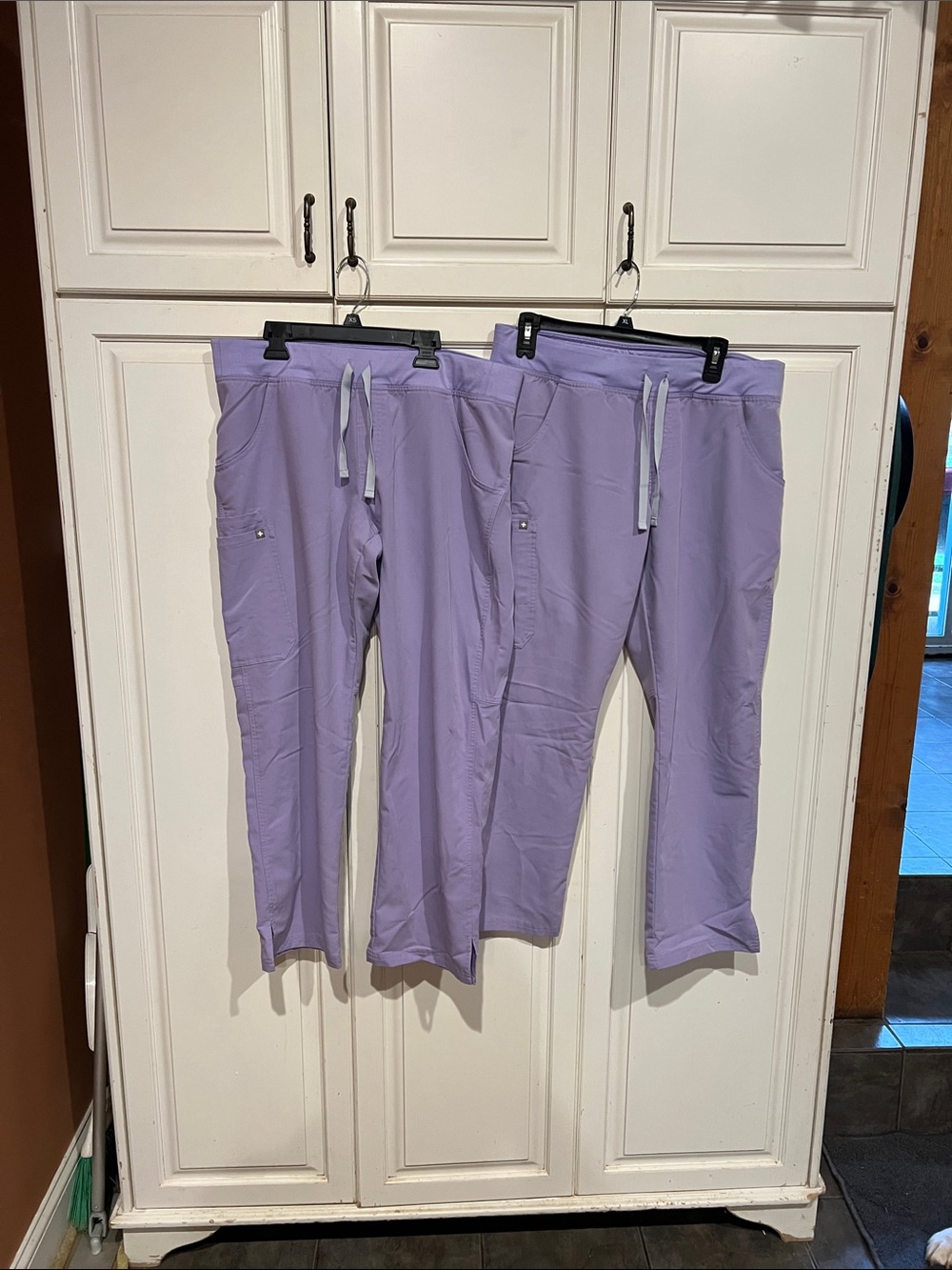 FIGS scrub sets. TWO SETS in lavender. Tops size XL bottoms size L.